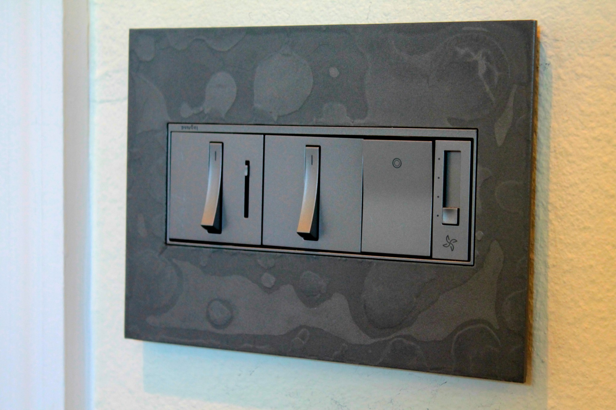 Decorative switch plate from Legrand & Hubbardton in Burnished