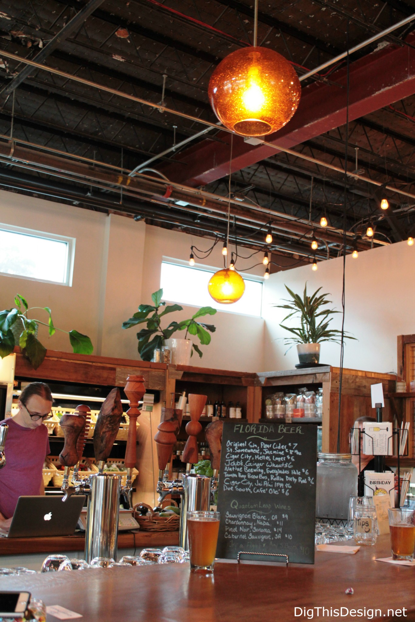 Local Roots wood bar and glass pendant lights at East End Market