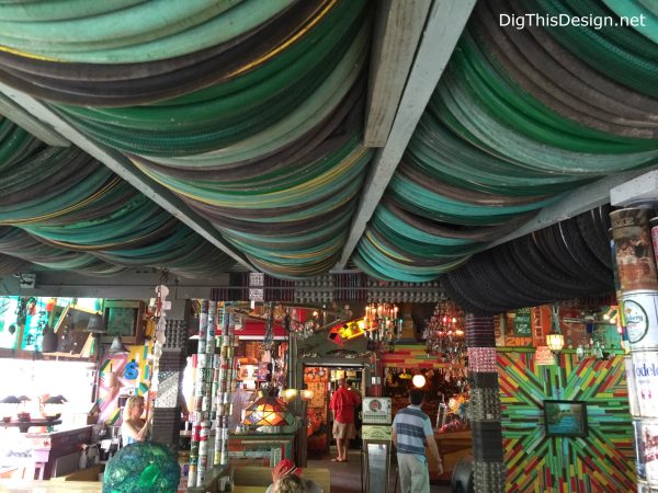 Satchel's eclectic decor, repurposed bicycle tires and garden hoses for ceiling decor.