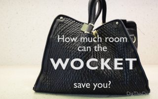 How much room can the Wocket smart wallet save you? Black purse on a white counter top