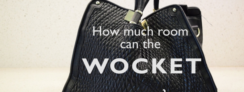 How much room can the Wocket smart wallet save you? Black purse on a white counter top