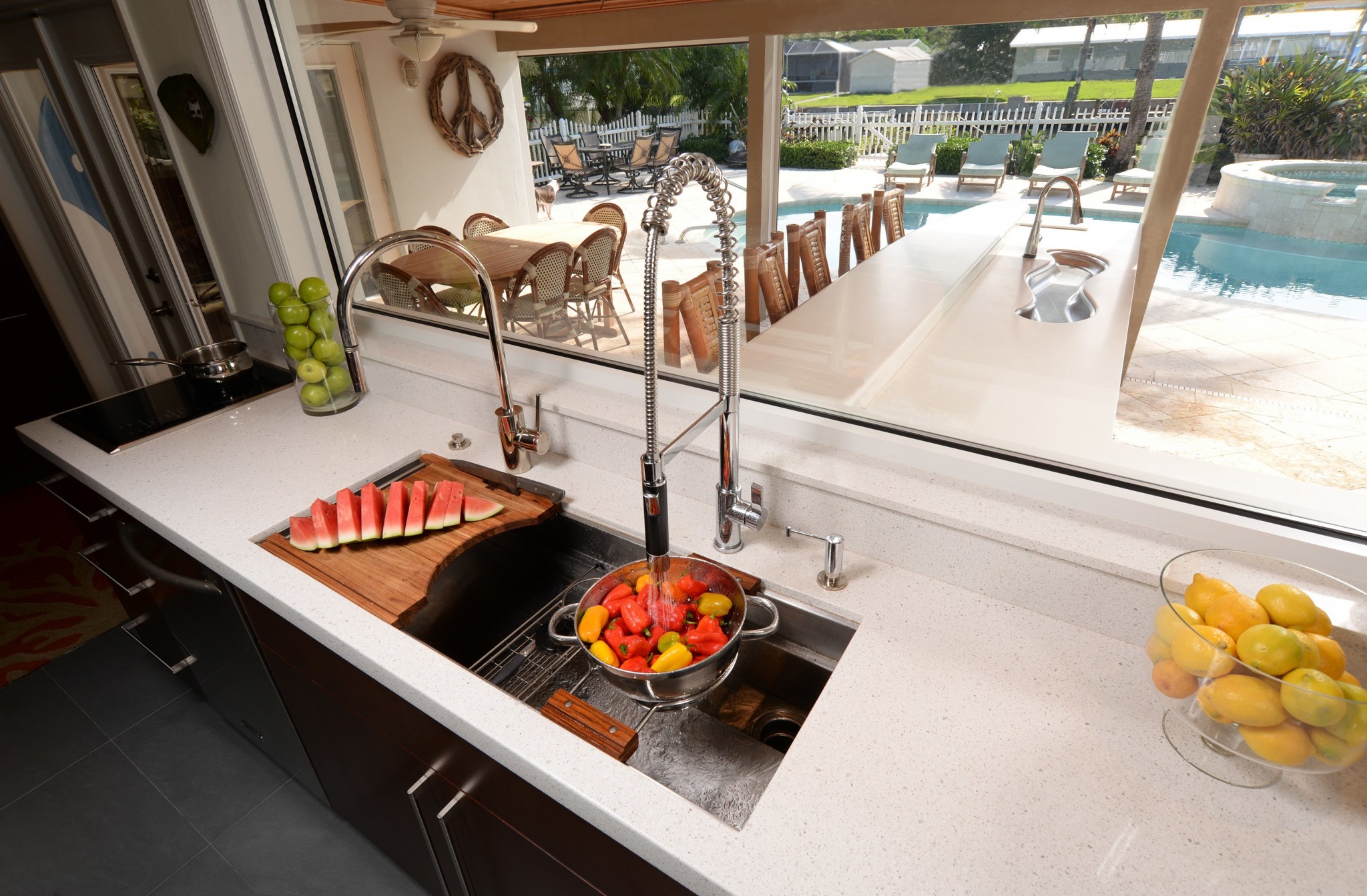 A chef sink with a two burner induction cooktop makes the perfect cleanup prep area.