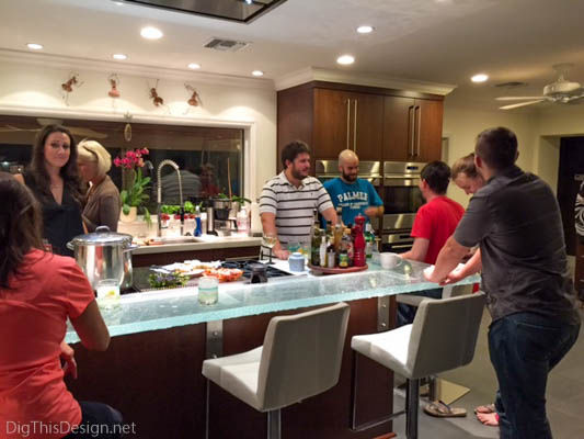 Family in contemporary kitchen gathering at Thanksgiving holiday.