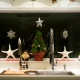 Christmas window sill decor with starfish rosemary christmas tree and ornaments