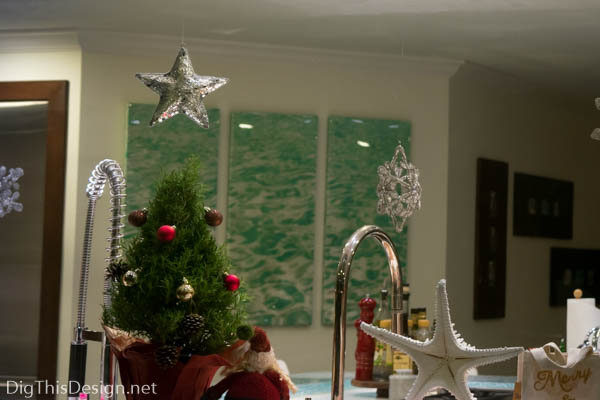 Christmas window sill decor rosemary with ornaments starfish and silver mirror stars