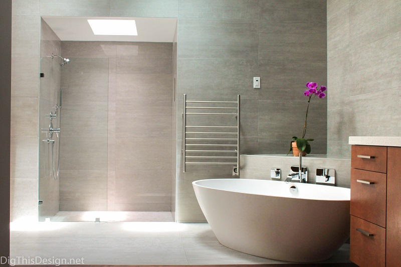 modern open master bathroom with walk in shower and stand alone soaking tub