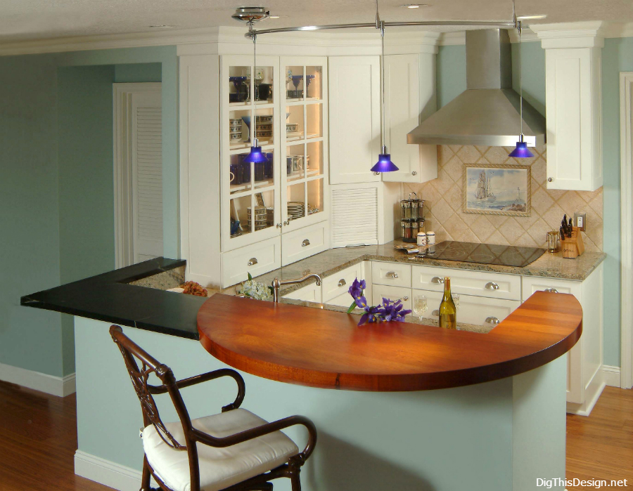 small contemporary kitchen with white cabinetry, peninsula seating at layered wood and stone countertops