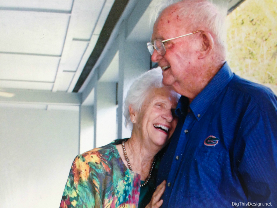Picture of a loving elderly couple laughing.