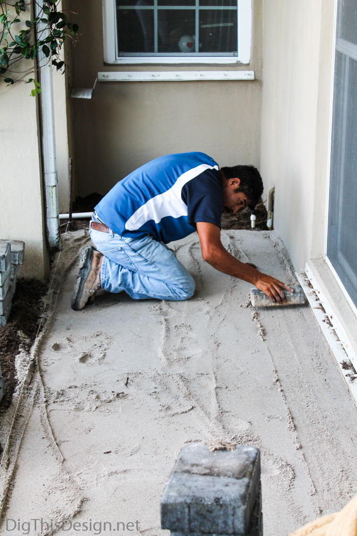 Creating a sand bed for a paver porch.