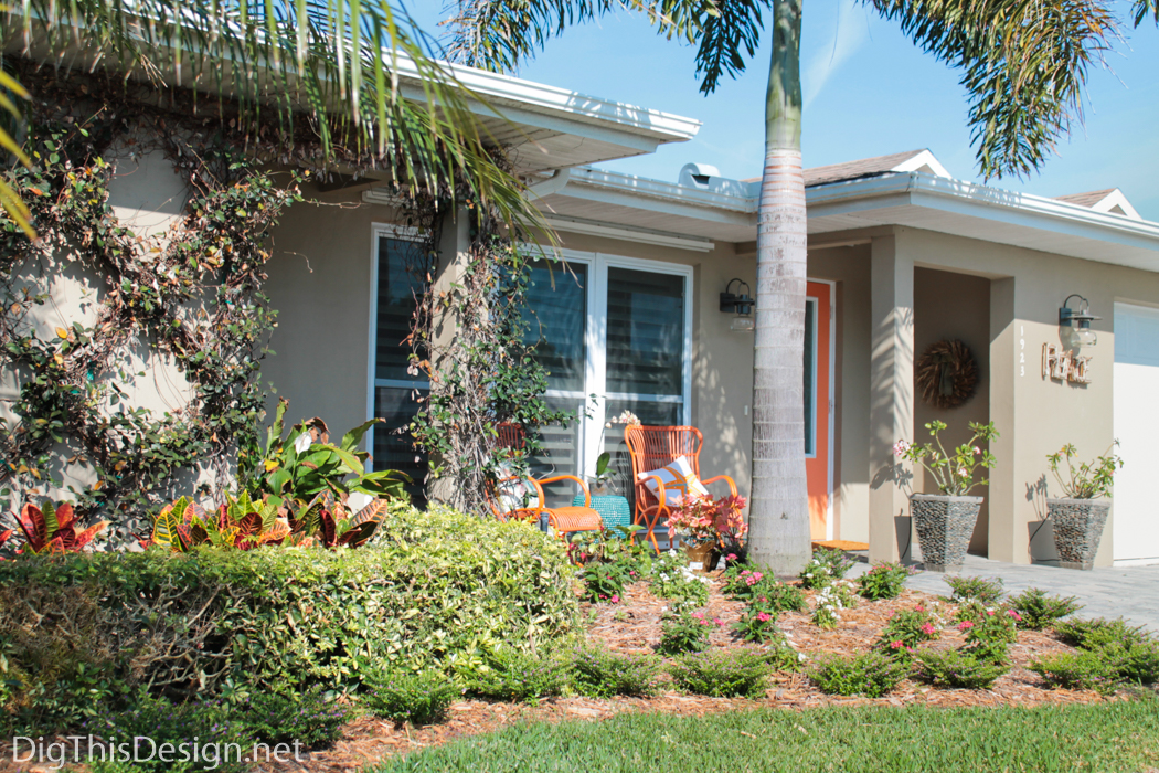 New landscape and orange decor for the front porch design project.