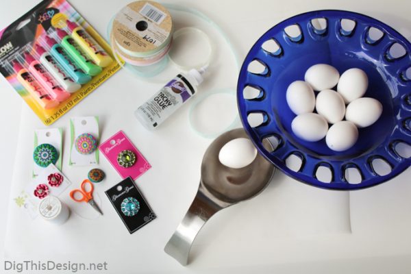 Tools and materials needed for decorating hollow eggs for Easter decor.