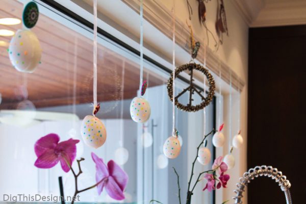 Easter decor with hanging decorative hollow eggs for window or fireplace mantle decor.