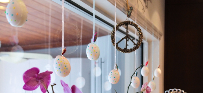 Easter decor with hanging decorative hollow eggs for window or fireplace mantle decor.