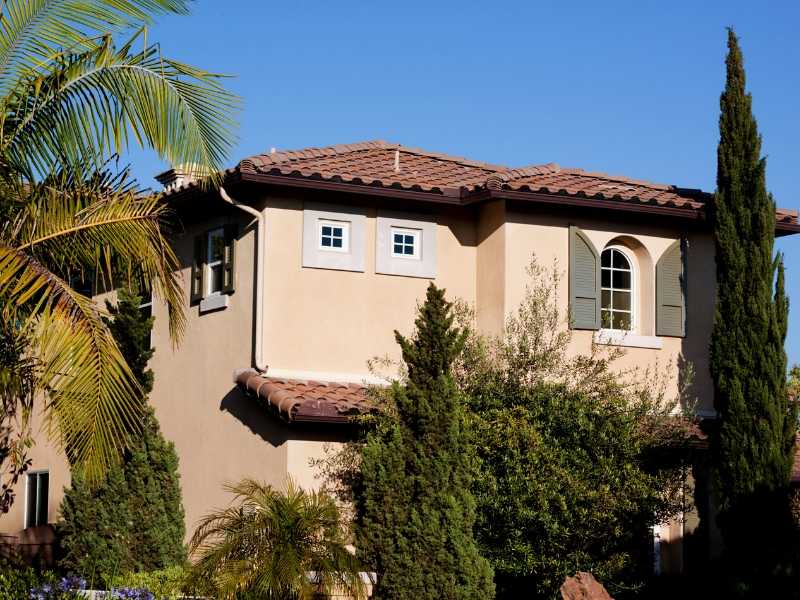 Southwest Style Wood Shutters on Stucco