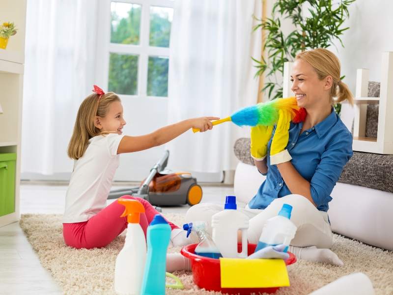 Happy family deep-cleaning together