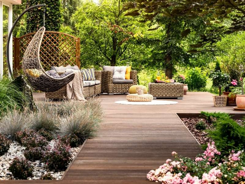 The Relaxing and Surprising Benefits of Owning Garden Furniture - Outdoor rattan furniture on wooden deck