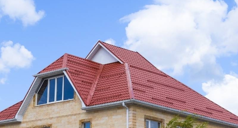 Material Options for Residential Roofs - Home with Red Metal Roof