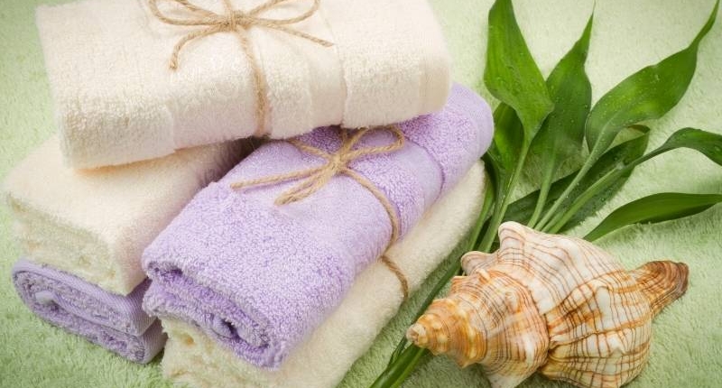 Modern uses of bamboo material seen here is white and lavender bamboo bath towels.