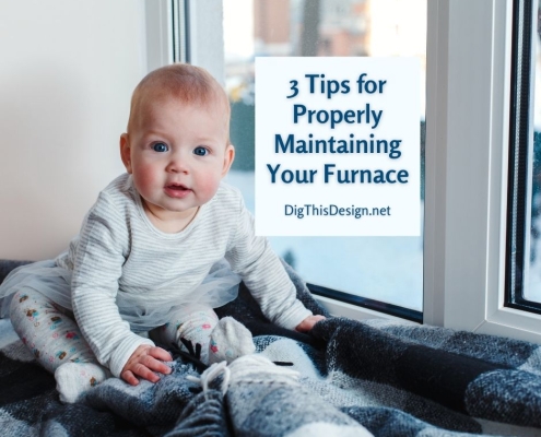 3 Tips for Properly Maintaining Your Furnace - baby sitting by winter window on blue and grey plaid blankets.