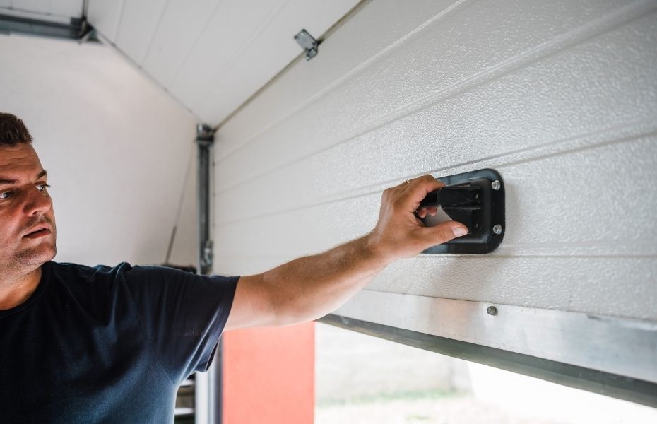 Repair of Garage Doors - main holding insdie garage door handle.