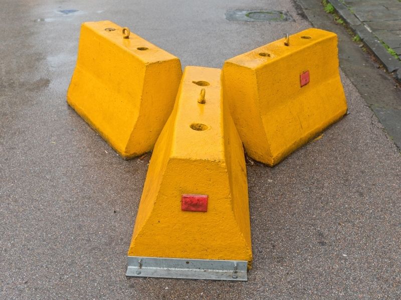 Jersey Concrete Barriers - photo of three jersey concrete barriers in bright yellow.