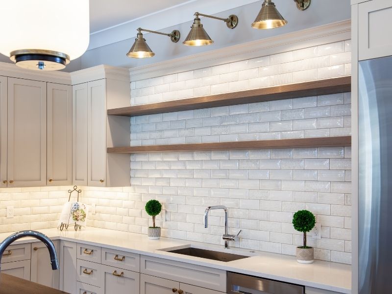 10 Shelving inspirations For A Trendy Home - Open shelving in kitchen over the sink.