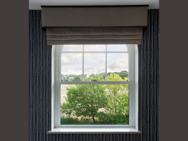 Dark valance on arch window.