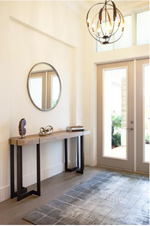 Decorating a foyer with a mirror.